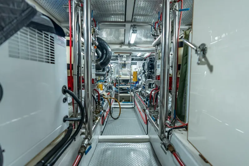 Mountain Mermaid Yacht Photos Pics Engine room of 2004 Offshore Yachts 54 Pilothouse, featuring complex machinery and piping.
