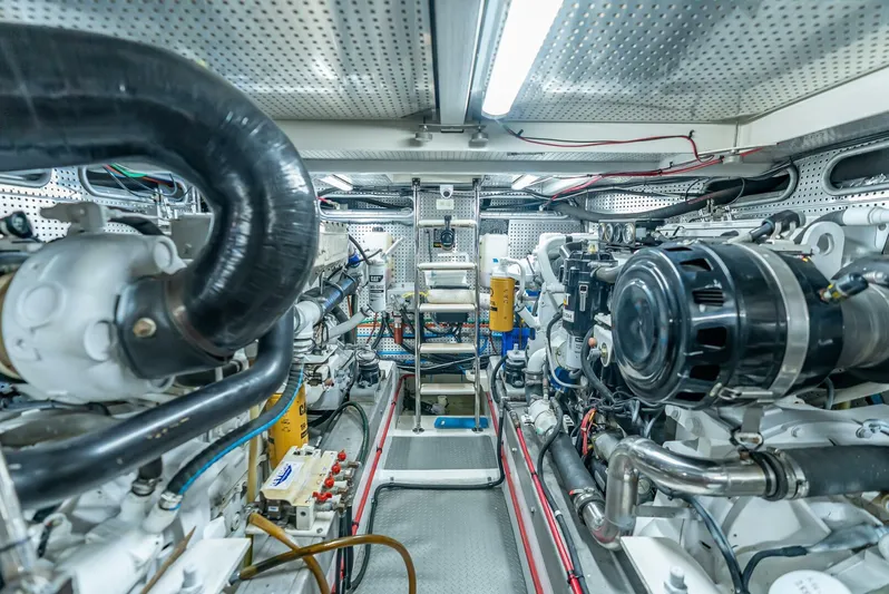 Mountain Mermaid Yacht Photos Pics Engine room of a 2004 Offshore Yachts 54 Pilothouse, showcasing mechanical components and systems.