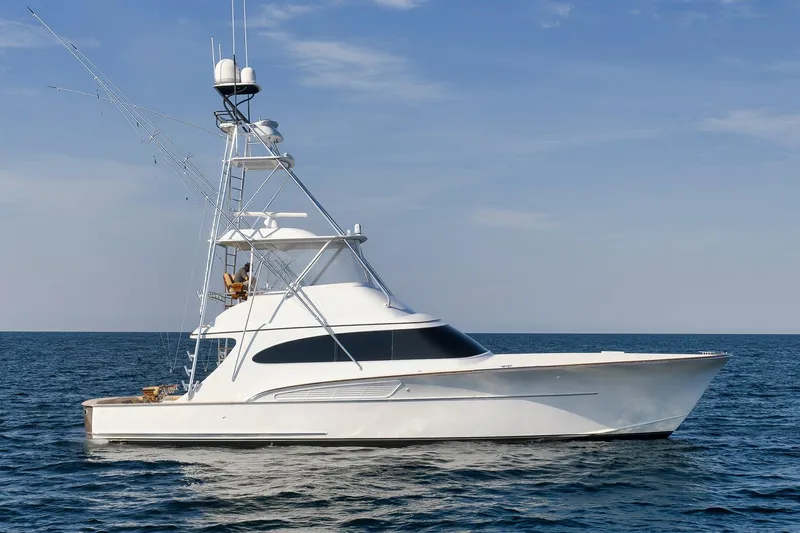 Raise Em Up Yacht Photos Pics 2007 Sunny Briggs Custom Carolina Sportfish yacht on open sea under clear sky.