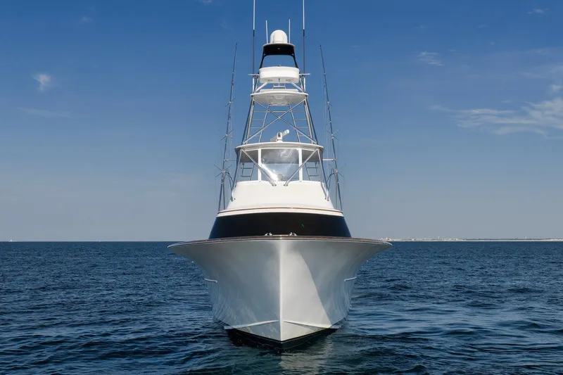 Raise Em Up Yacht Photos Pics 2007 Sunny Briggs Custom Carolina Sportfish yacht on open sea under clear blue sky.