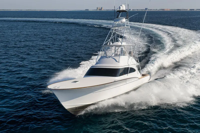 Raise Em Up Yacht Photos Pics 2007 Sunny Briggs Custom Carolina Sportfish cruising on open ocean waters.