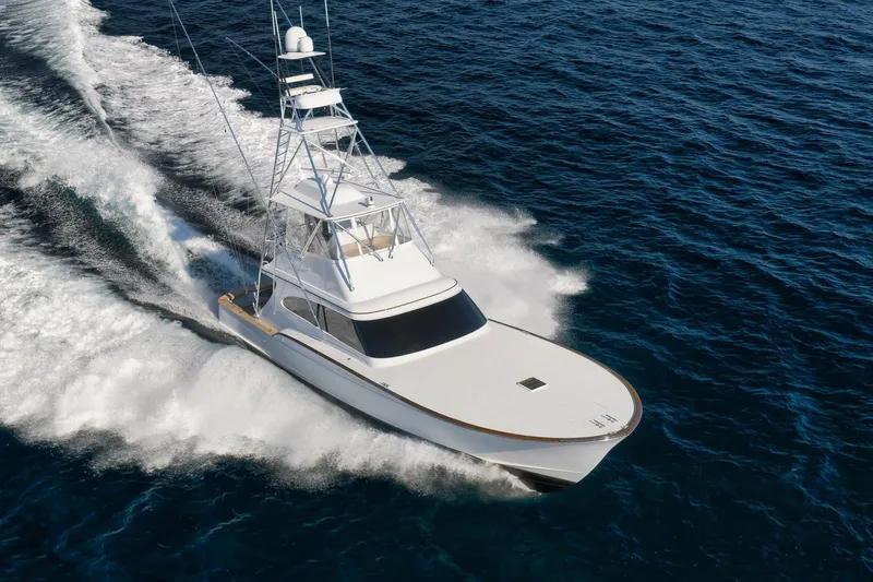 Raise Em Up Yacht Photos Pics 2007 Sunny Briggs Custom Carolina Sportfish cruising on open ocean waters.