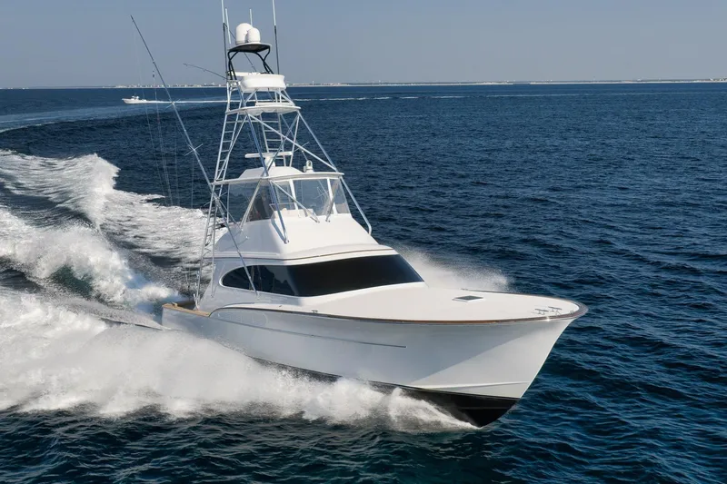 Raise Em Up Yacht Photos Pics 2007 Sunny Briggs Custom Carolina Sportfish cruising on open ocean waters.