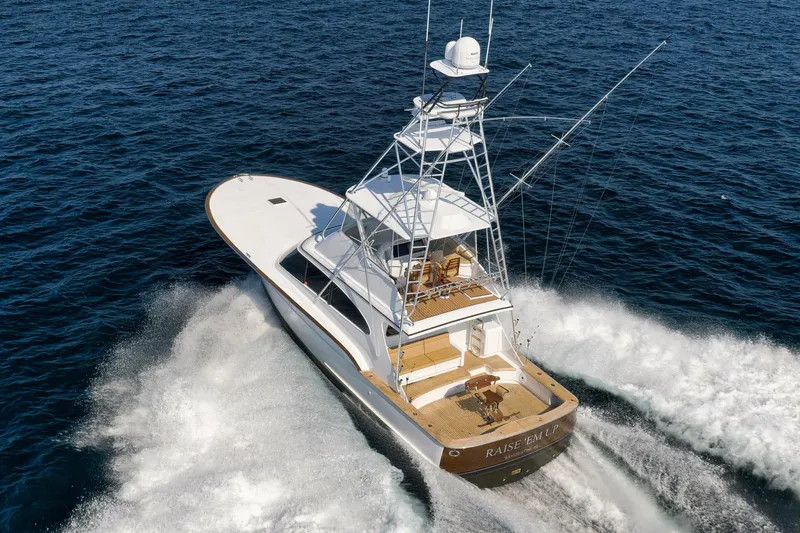 Raise Em Up Yacht Photos Pics 2007 Sunny Briggs Custom Carolina Sportfish cruising on open ocean waters.