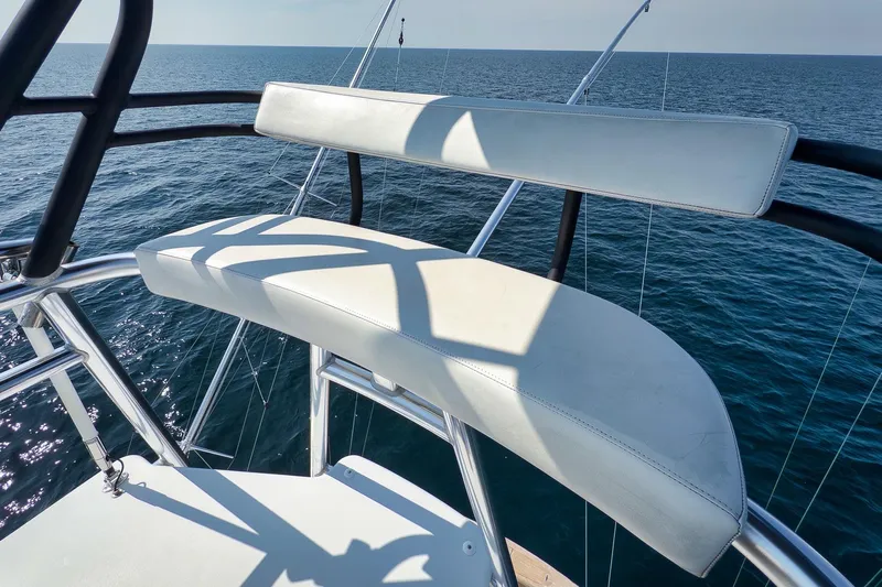 Raise Em Up Yacht Photos Pics Sunny Briggs 2007 Custom Carolina Sportfish boat with white seating, ocean view.