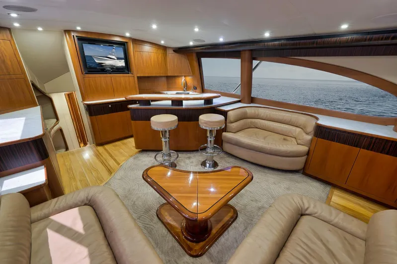 Raise Em Up Yacht Photos Pics Luxurious interior of 2007 Sunny Briggs Custom Carolina Sportfish yacht with elegant seating and ocean view.