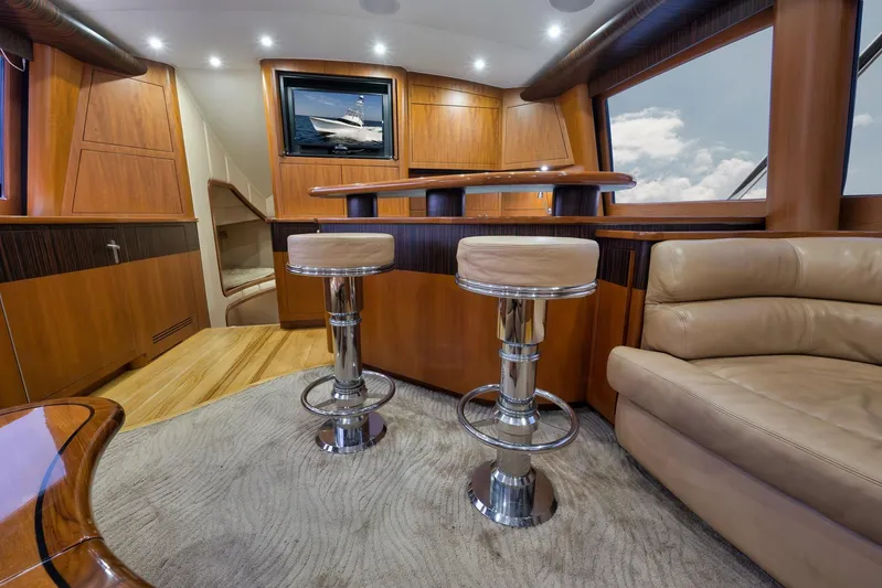 Raise Em Up Yacht Photos Pics Luxurious interior of 2007 Sunny Briggs Custom Carolina Sportfish yacht with elegant wood finishes.