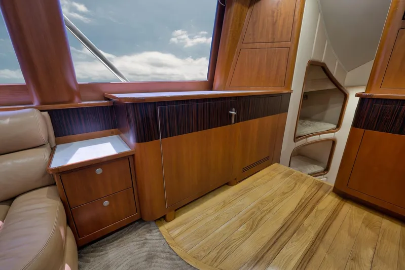 Raise Em Up Yacht Photos Pics Luxurious interior of 2007 Sunny Briggs Custom Carolina Sportfish yacht with wood cabinetry and seating.