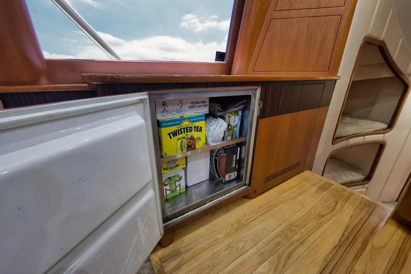 Raise Em Up Yacht Photos Pics Mini fridge stocked with beverages inside a 2007 Sunny Briggs Custom Carolina Sportfish yacht.