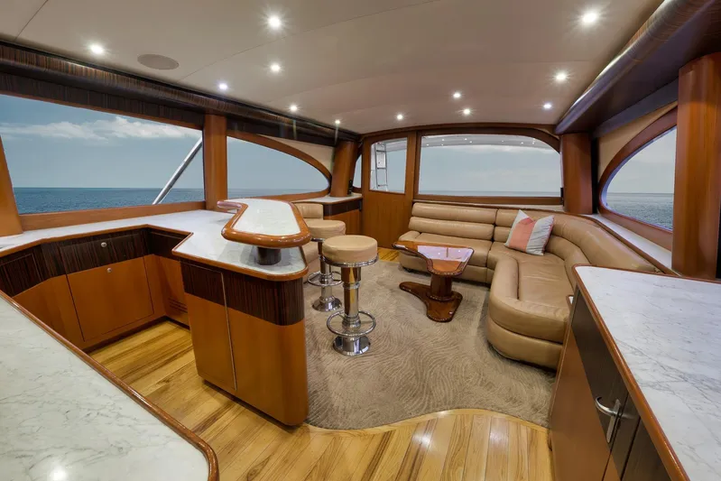 Raise Em Up Yacht Photos Pics Luxurious interior of 2007 Sunny Briggs Custom Carolina Sportfish yacht with elegant seating and ocean view.