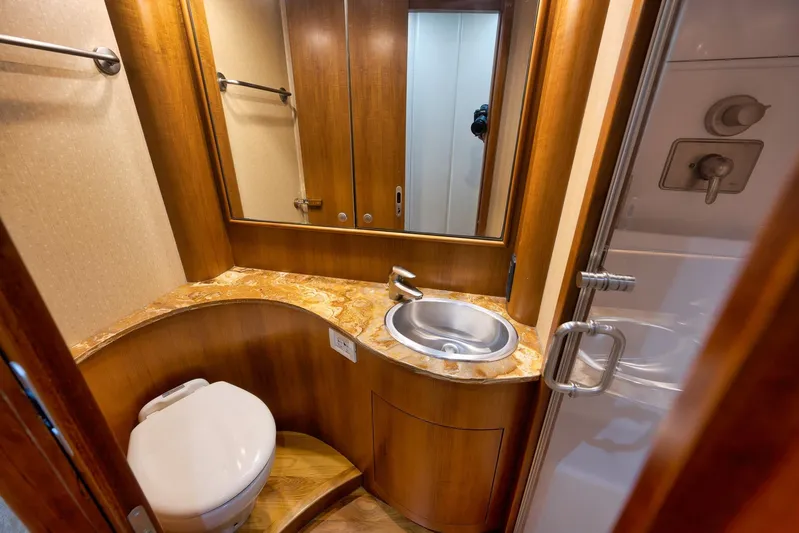 Raise Em Up Yacht Photos Pics Luxurious 2007 Sunny Briggs Custom Carolina Sportfish bathroom with wood accents and modern fixtures.