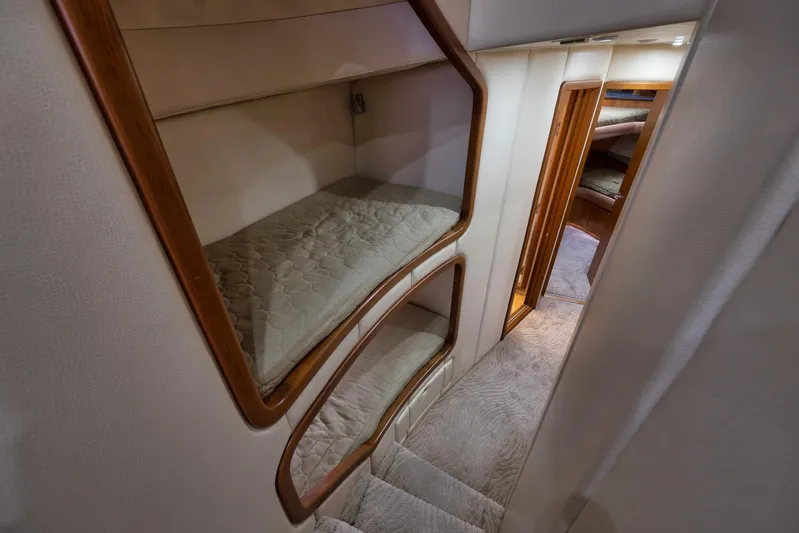 Raise Em Up Yacht Photos Pics Interior of 2007 Sunny Briggs Custom Carolina Sportfish with cozy bunk beds and hallway.