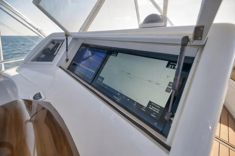 Raise Em Up Yacht Photos Pics Control panel of 2007 Sunny Briggs Custom Carolina Sportfish boat with navigation screens.