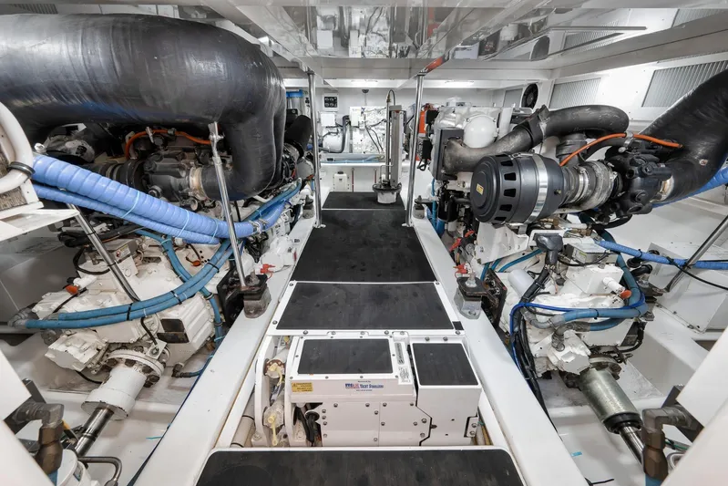 Raise Em Up Yacht Photos Pics Engine room of 2007 Sunny Briggs Custom Carolina Sportfish, showcasing dual engines and mechanical systems.