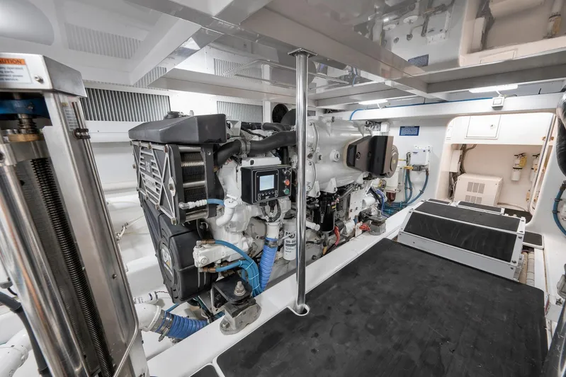 Raise Em Up Yacht Photos Pics Engine room of 2007 Sunny Briggs Custom Carolina Sportfish, showcasing detailed machinery and components.