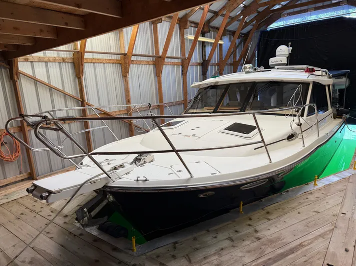 Cannery Row Yacht Photos Pics 2015 Cutwater C-30 Sedan boat stored in a wooden boathouse.