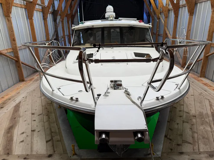 Cannery Row Yacht Photos Pics 2015 Cutwater C-30 Sedan boat in wooden storage shed, front view.