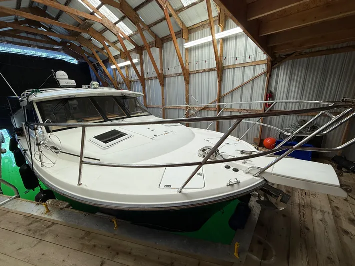 Cannery Row Yacht Photos Pics 2015 Cutwater C-30 Sedan boat in a wooden boathouse.