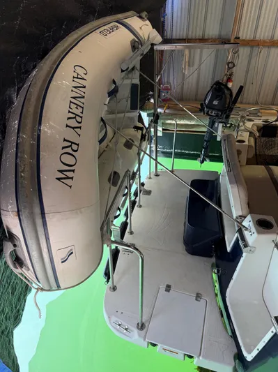 Cannery Row Yacht Photos Pics 2015 Cutwater C-30 Sedan with attached dinghy in a covered dock.