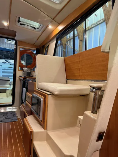 Cannery Row Yacht Photos Pics Interior of 2015 Cutwater C-30 Sedan boat with seating and kitchenette.