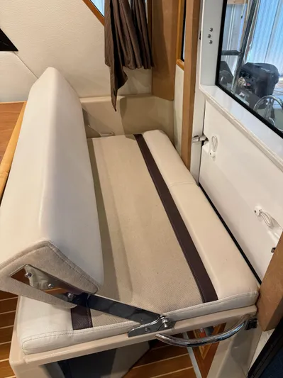 Cannery Row Yacht Photos Pics 2015 Cutwater C-30 Sedan interior with beige seating and wooden accents.