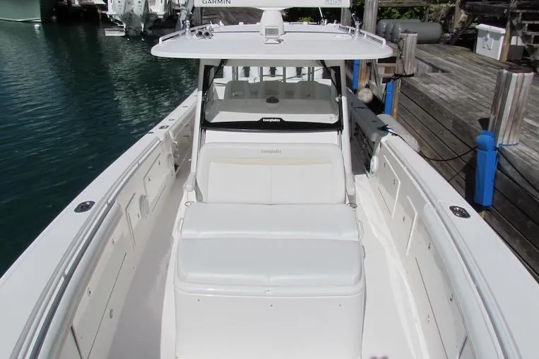  Yacht Photos Pics 2016 Everglades 435 Center Console boat docked, showcasing sleek design and spacious seating.