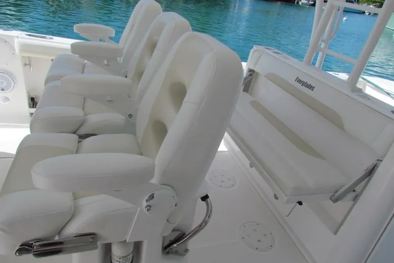  Yacht Photos Pics Luxury seating on 2016 Everglades 435 Center Console boat, with white leather chairs.
