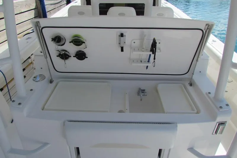  Yacht Photos Pics 2016 Everglades 435 Center Console fishing station with tackle storage and equipment holders.