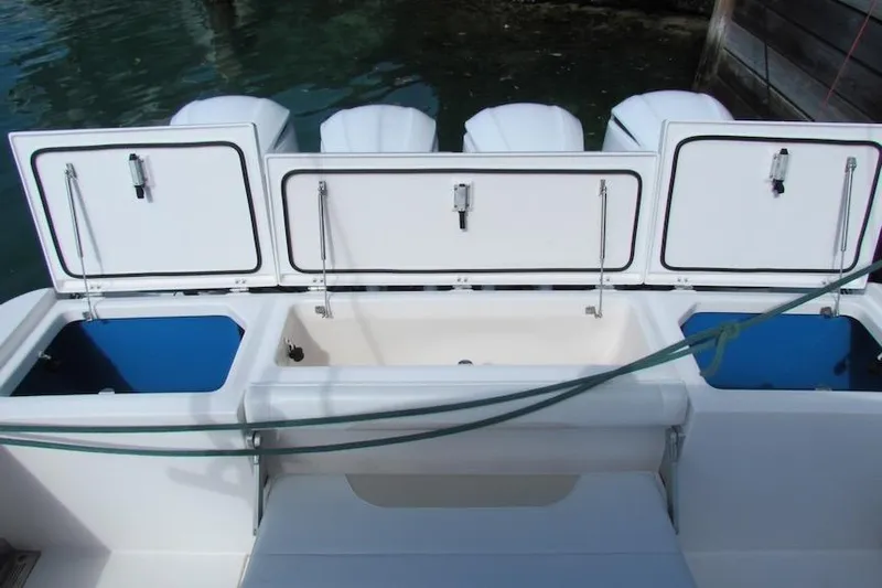  Yacht Photos Pics 2016 Everglades 435 Center Console boat with open storage compartments.