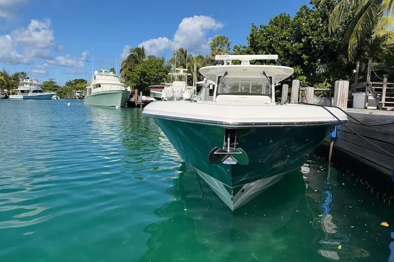  Yacht Photos Pics 2016 Everglades 435 Center Console boat docked in clear blue water.