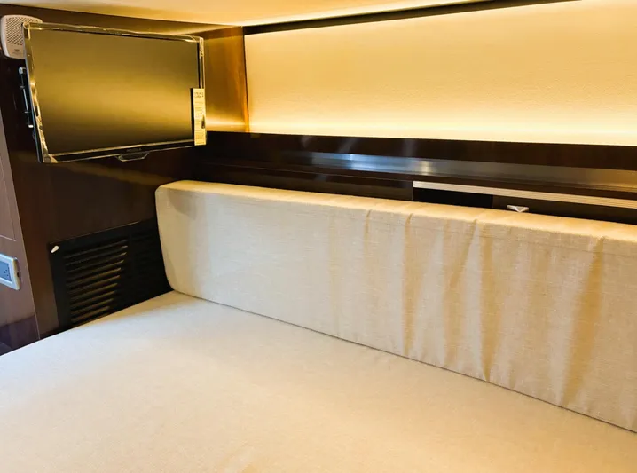  Yacht Photos Pics Interior of 2020 Sea Ray 320 Sundancer, featuring a cozy seating area and modern TV.