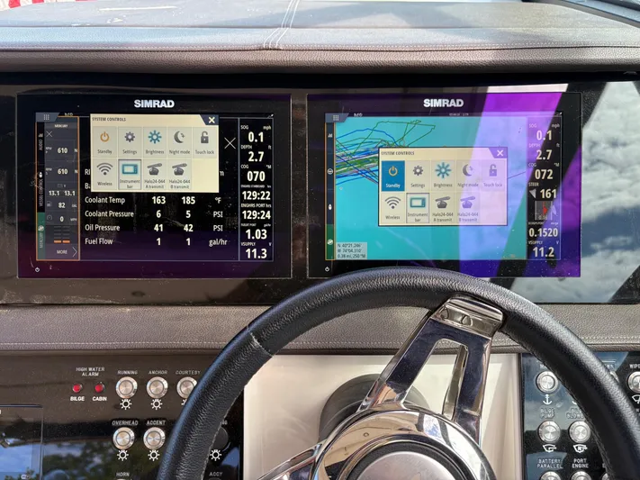  Yacht Photos Pics Dashboard of a 2020 Sea Ray 320 Sundancer with Simrad navigation displays.