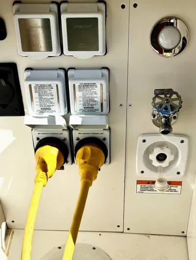  Yacht Photos Pics Electrical panel on a 2020 Sea Ray 320 Sundancer boat with yellow power cords.