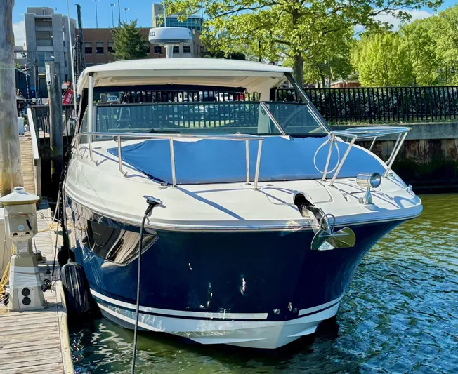  Yacht Photos Pics 2020 Sea Ray 320 Sundancer docked in a sunny marina setting.