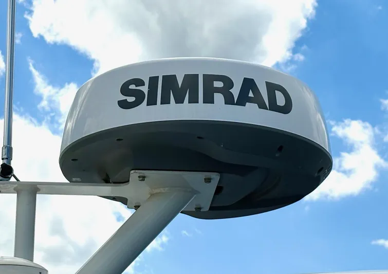  Yacht Photos Pics Simrad radar on 2020 Sea Ray 320 Sundancer against a blue sky.
