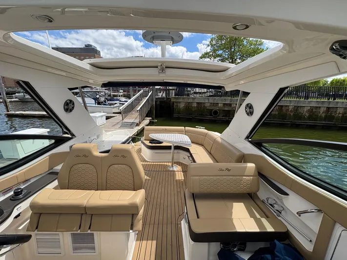  Yacht Photos Pics Luxurious 2020 Sea Ray 320 Sundancer boat interior with beige seating and open sunroof.