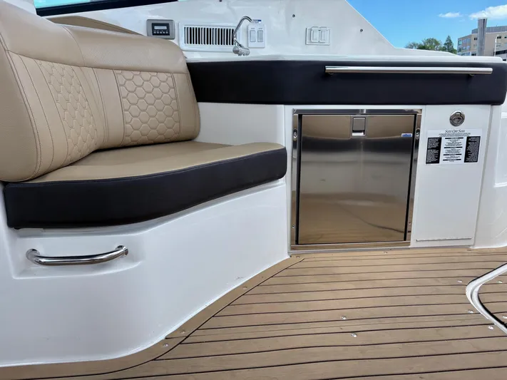  Yacht Photos Pics 2020 Sea Ray 320 Sundancer interior with beige seating and stainless steel accents.