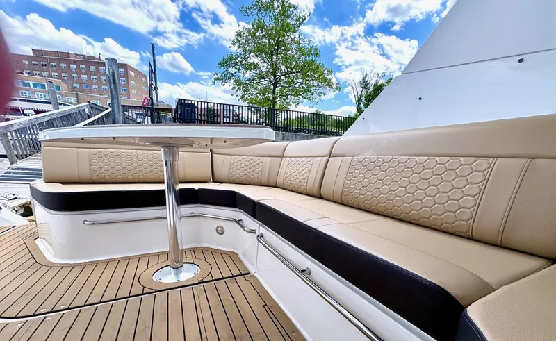  Yacht Photos Pics 2020 Sea Ray 320 Sundancer boat with beige seating and wooden deck.