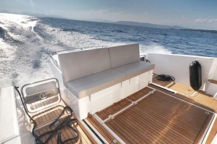  Yacht Photos Pics 2024 Parker Poland 110 Monaco boat deck with seating, cruising on open water.