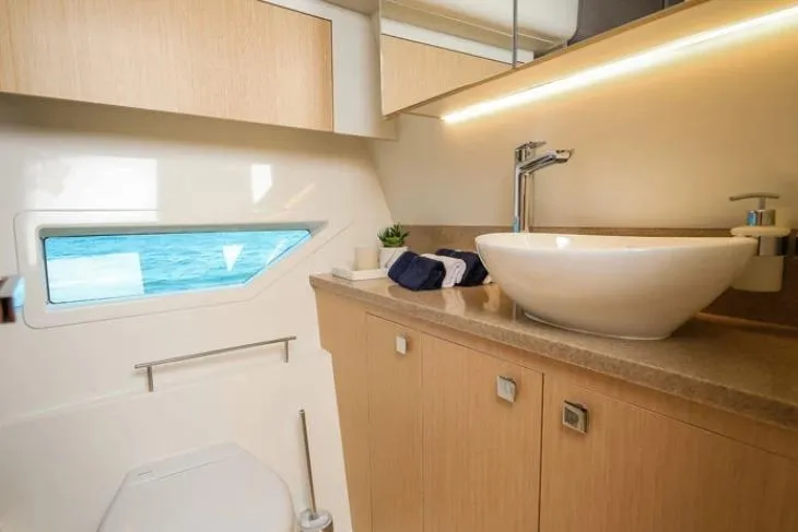  Yacht Photos Pics Luxurious bathroom in 2024 Parker Poland 110 Monaco yacht with modern fixtures and ocean view.