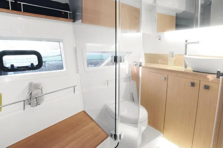  Yacht Photos Pics Modern bathroom interior of 2024 Parker Poland 110 Monaco yacht, featuring sleek design and wood accents.