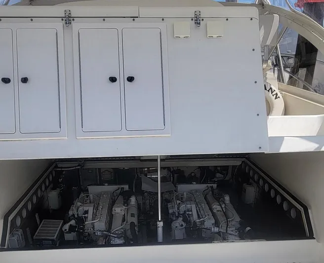 Robin Ann Yacht Photos Pics 2004 Carolina Classic 35 Express engine compartment with dual engines visible.