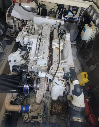 Robin Ann Yacht Photos Pics Engine compartment of a 2004 Carolina Classic 35 Express boat, showcasing detailed machinery.