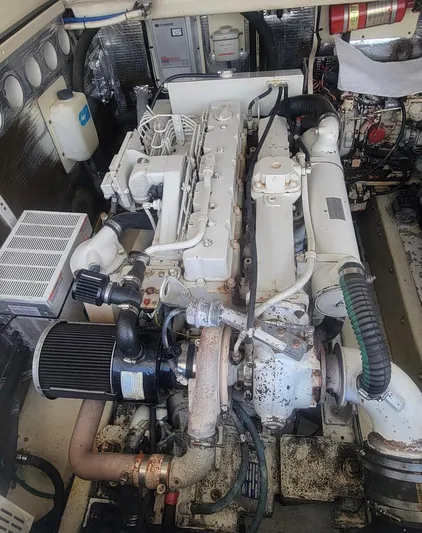 Robin Ann Yacht Photos Pics Engine room of a 2004 Carolina Classic 35 Express boat, showcasing detailed machinery.