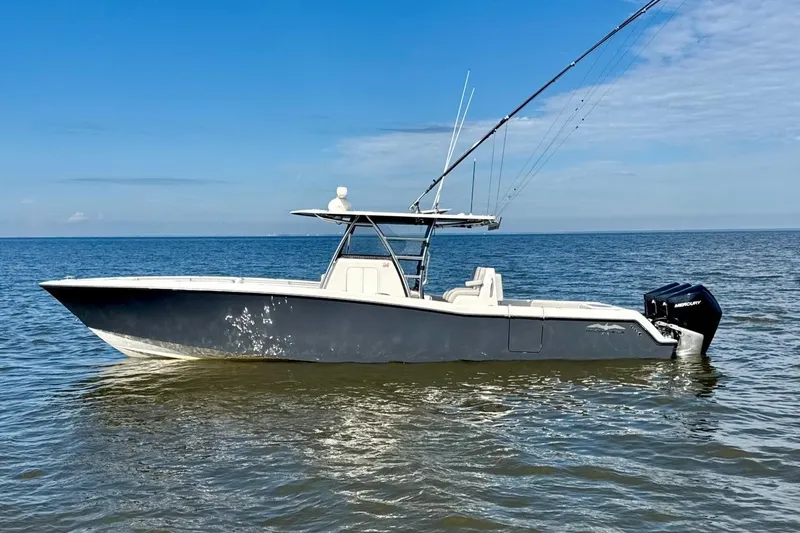  Yacht Photos Pics 2020 Invincible 36 Open Fisherman boat on calm ocean waters.
