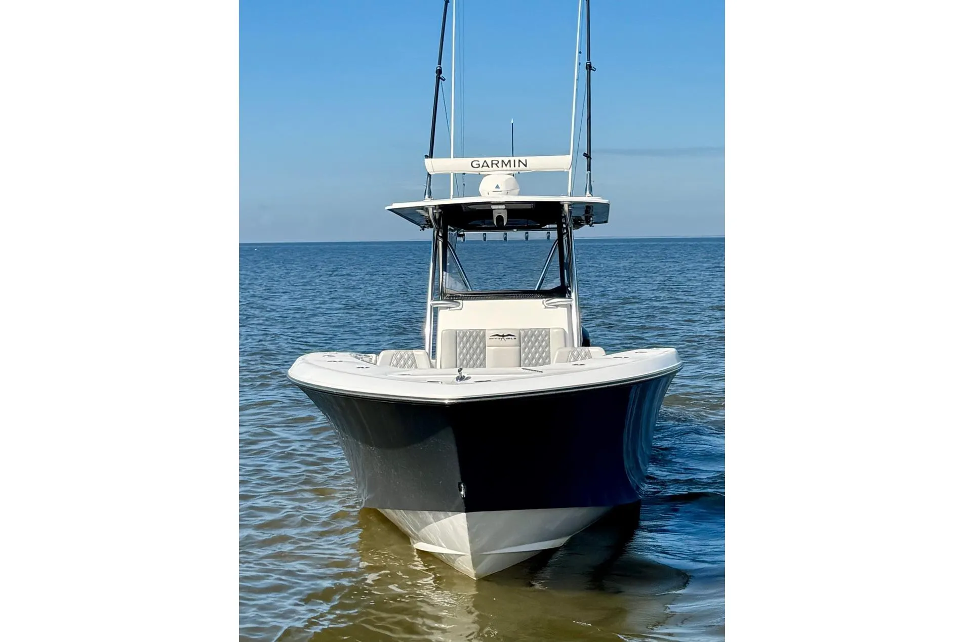2020 Invincible 36 Open Fisherman boat on calm water, front view.