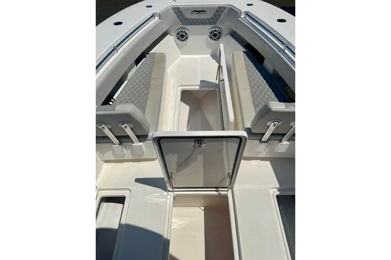  Yacht Photos Pics 2020 Invincible 36 Open Fisherman boat interior with seating and storage compartments.