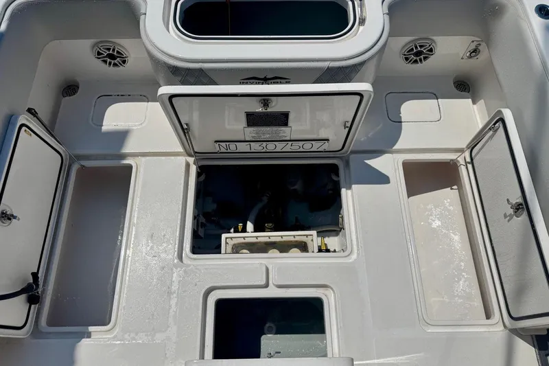  Yacht Photos Pics 2020 Invincible 36 Open Fisherman boat deck with open storage compartments.