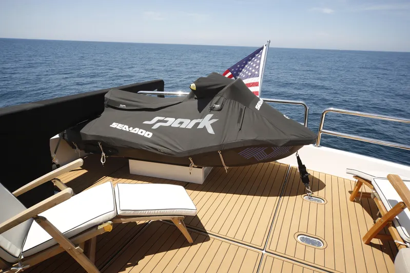 Southern Lady Yacht Photos Pics Luxury yacht deck with Sea-Doo Spark, Horizon E73, 2006, ocean view, American flag.