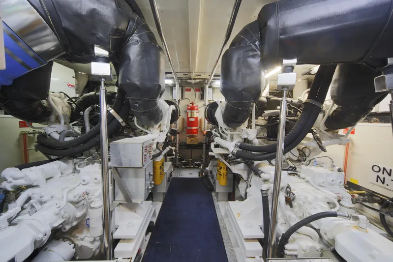 Southern Lady Yacht Photos Pics Engine room of 2006 Horizon E73 yacht with dual engines and fire extinguisher.
